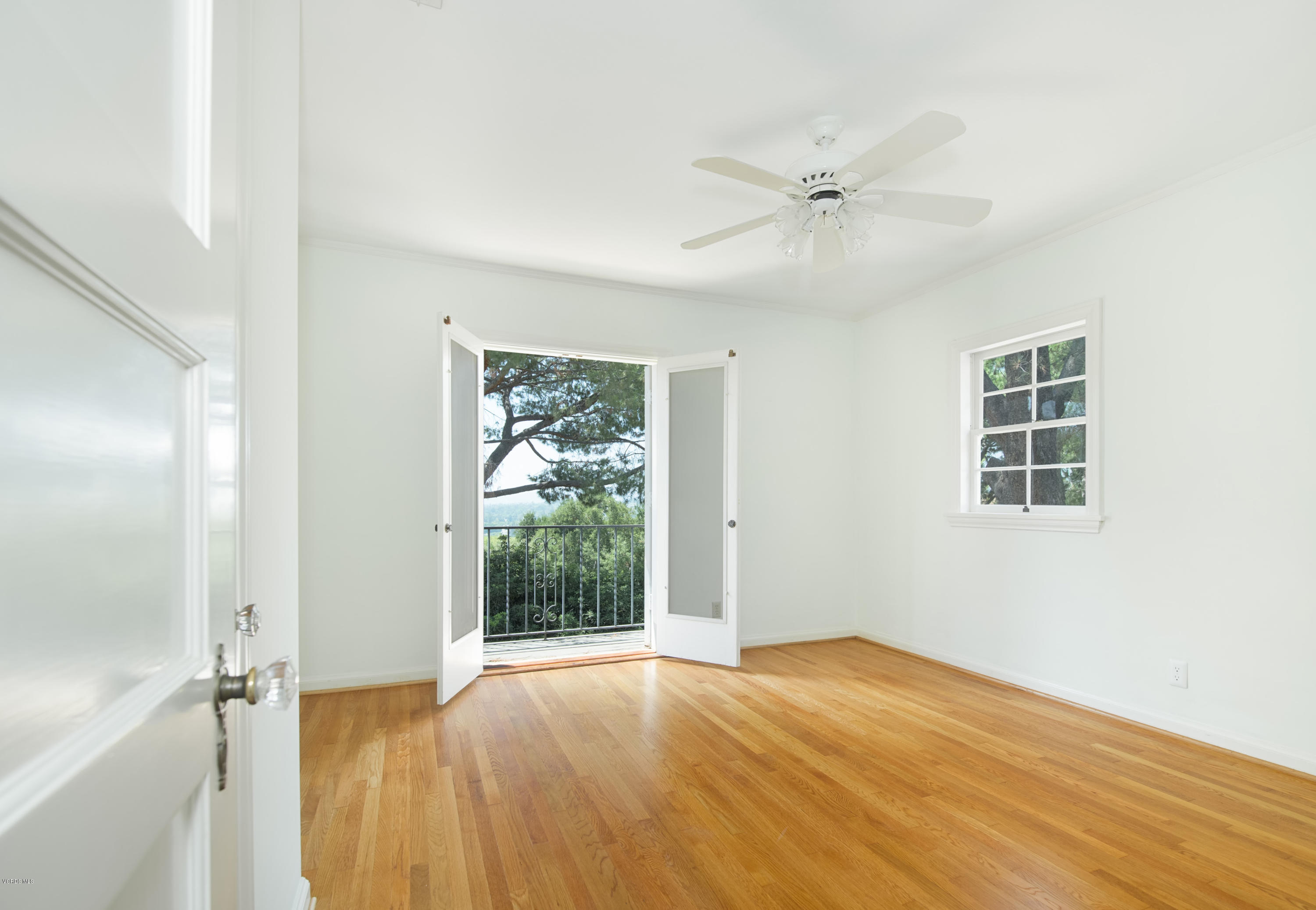 1447 Edgecliff Lane Pasadena, CA 91107 - Photo 21 of 33 a view of an empty room with a window and wooden floor