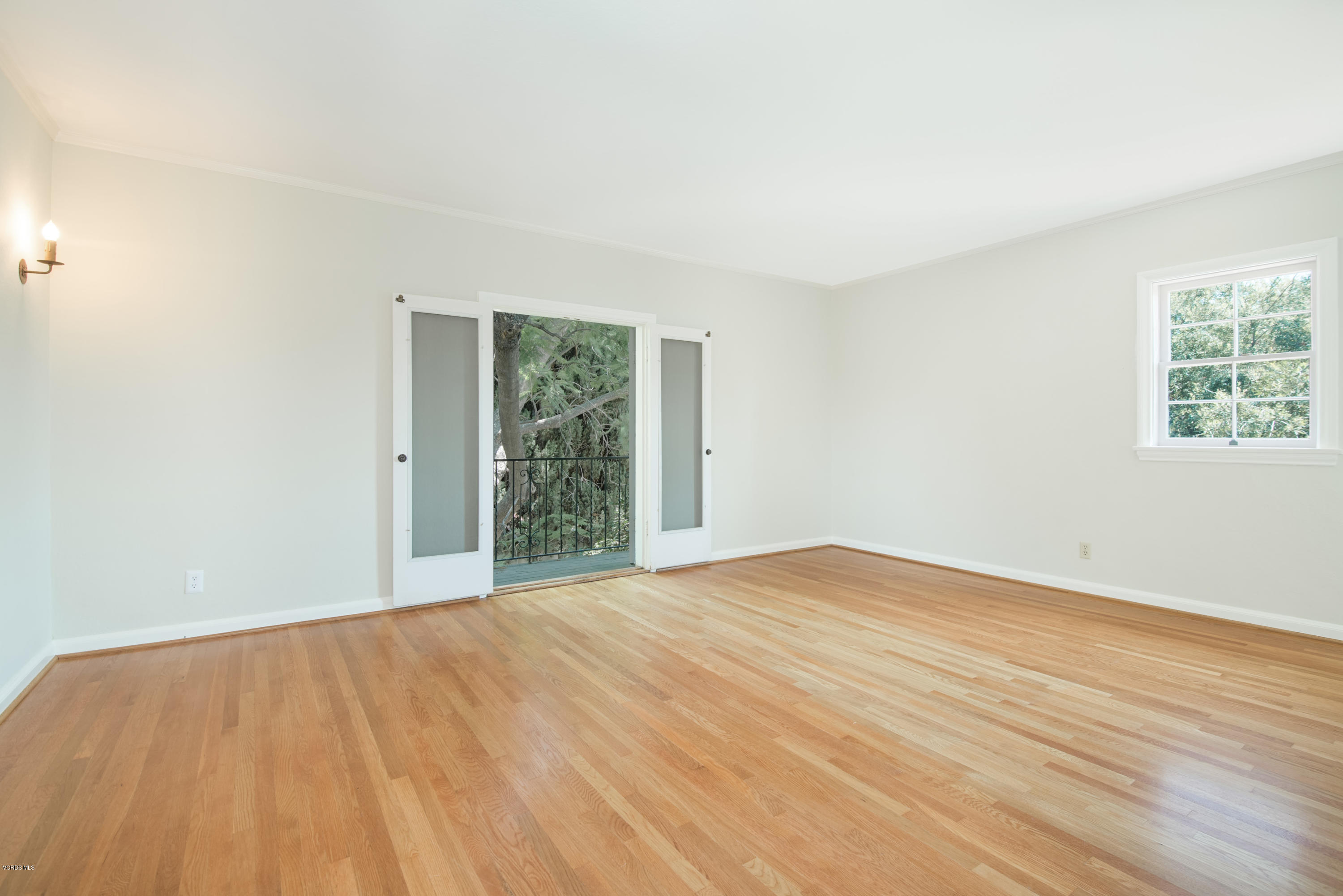 1447 Edgecliff Lane Pasadena, CA 91107 - Photo 22 of 33 a view of an empty room with wooden floor and a window