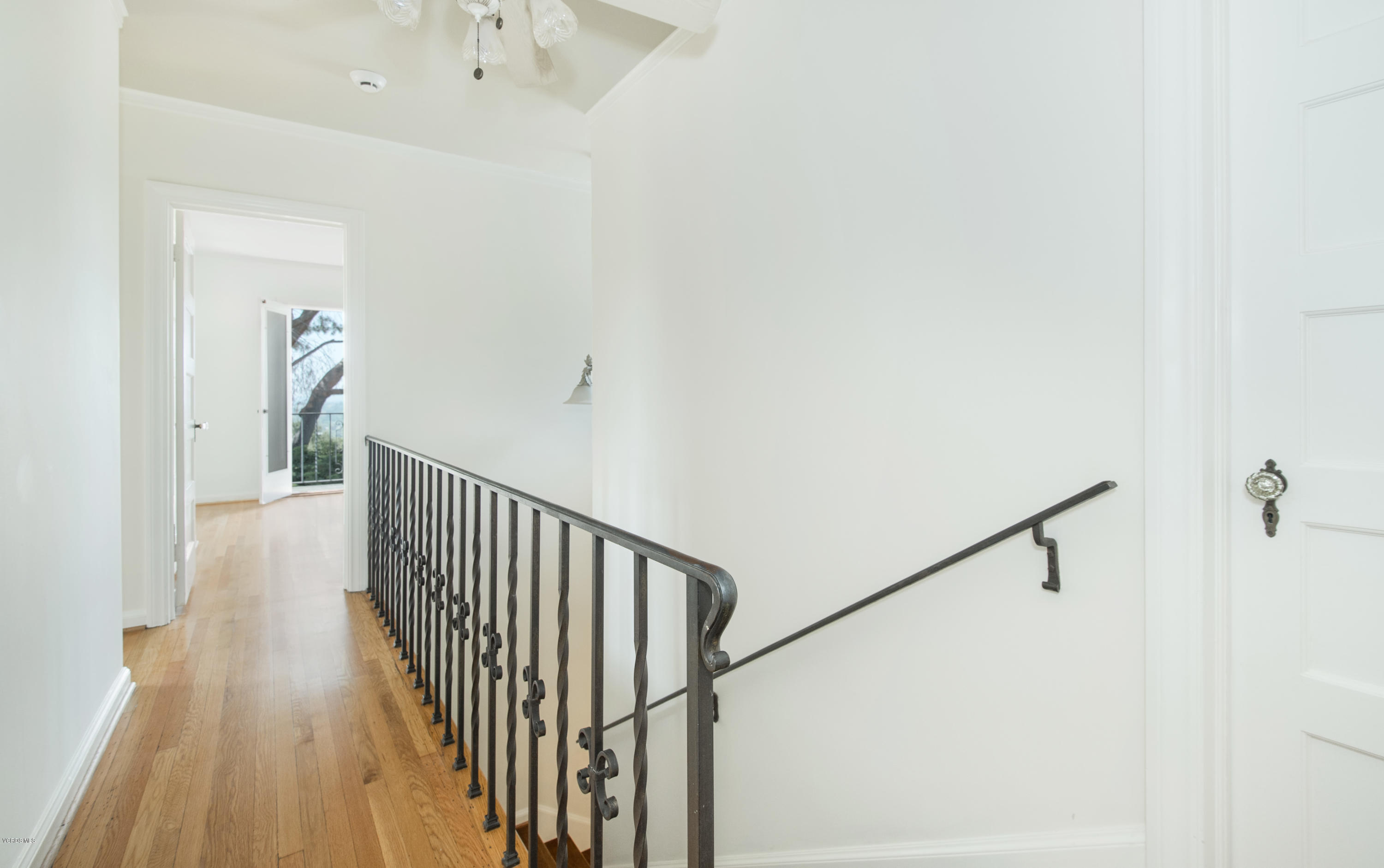 1447 Edgecliff Lane Pasadena, CA 91107 - Photo 23 of 33 a view of a hallway with wooden floor and staircase