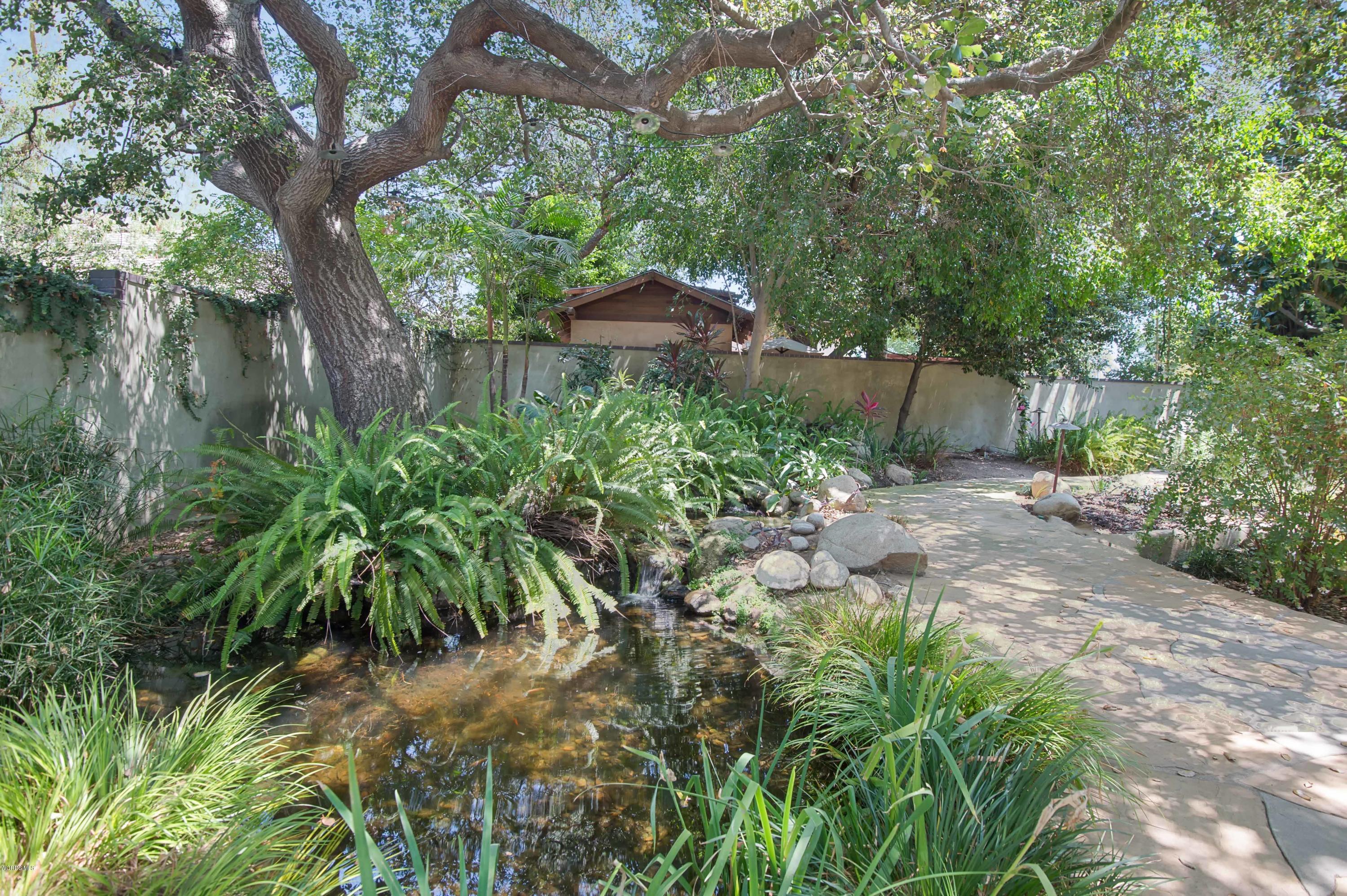 1447 Edgecliff Lane Pasadena, CA 91107 - Photo 9 of 33 a backyard of a house with lots of green space and fountain