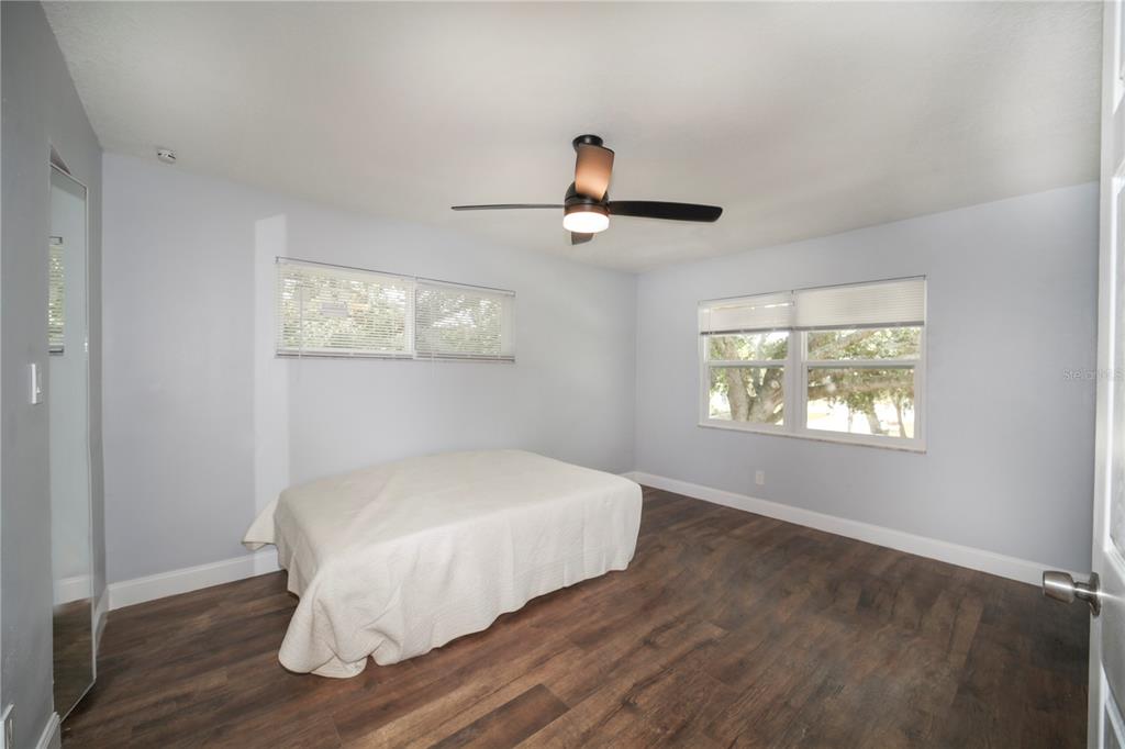 331 Amherst Avenue, Unit 56 Sarasota, FL 34232 - Photo 14 of 19 a bedroom with a bed and a window