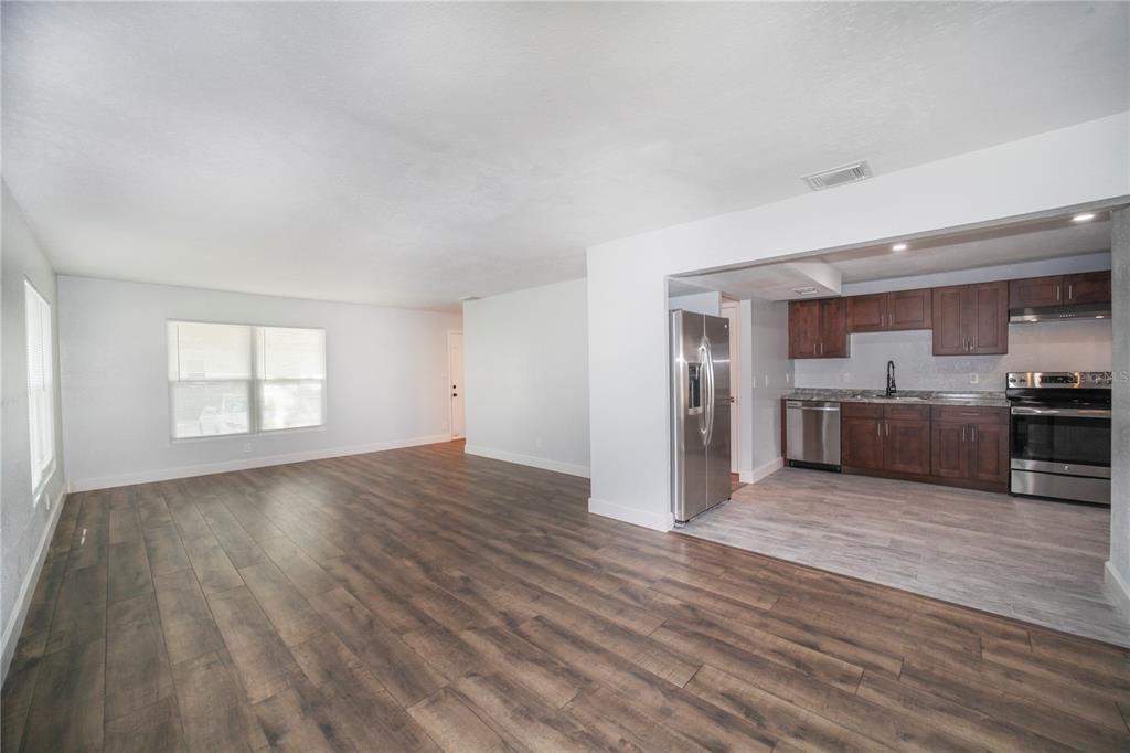 331 Amherst Avenue, Unit 56 Sarasota, FL 34232 - Photo 5 of 19 a view of a kitchen with a sink and a stove top oven
