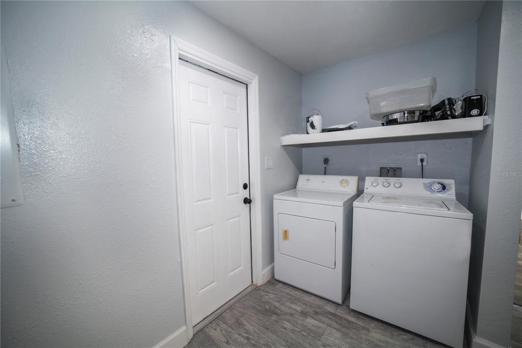 331 Amherst Avenue, Unit 56 Sarasota, FL 34232 - Photo 10 of 19 a utility room with dryer and washer