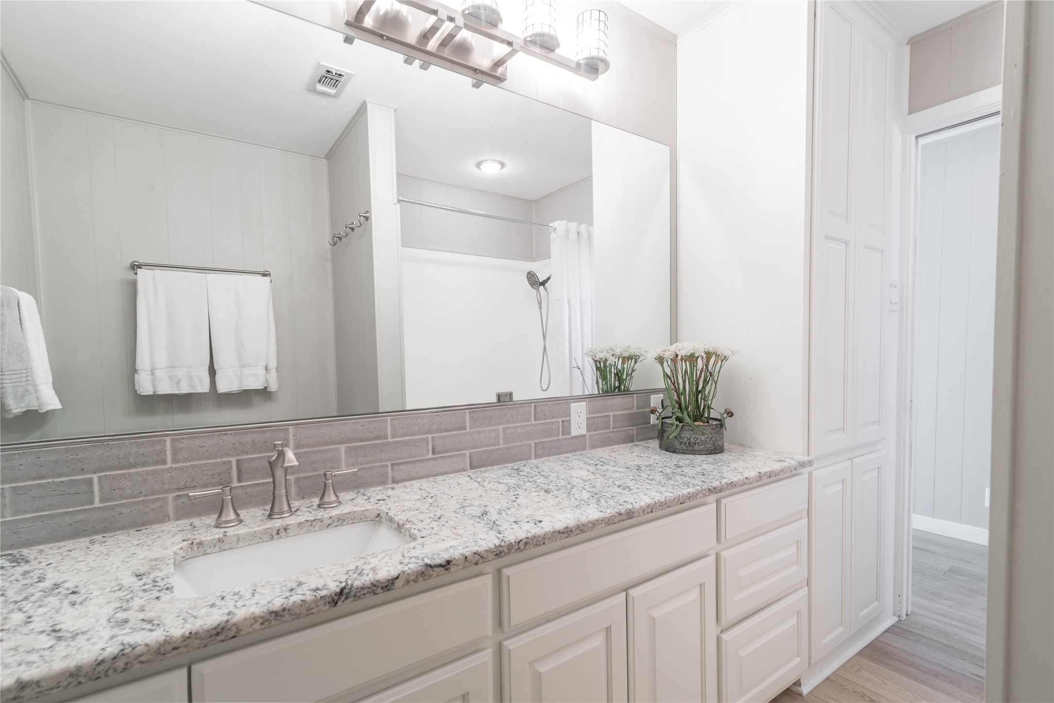 3807 Boat Dock Road Lago Vista, TX 78645 - Photo 18 of 37 Modern elegance defines this bathroom vanity, showcasing a spacious countertop and sleek fixtures.