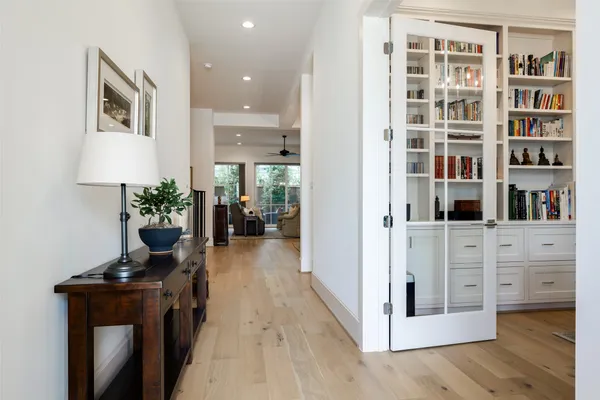 a view of living room filled with furniture and wooden floor