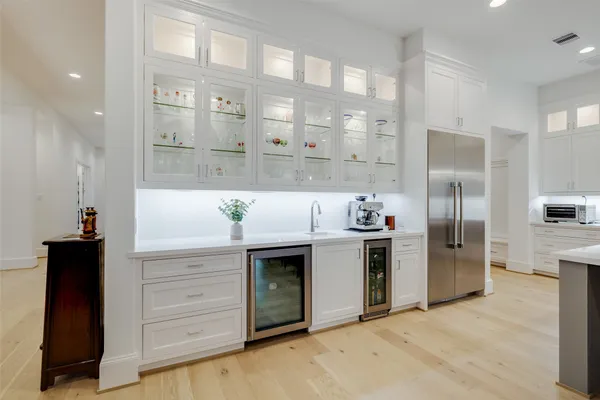 a large kitchen with a stove and a refrigerator