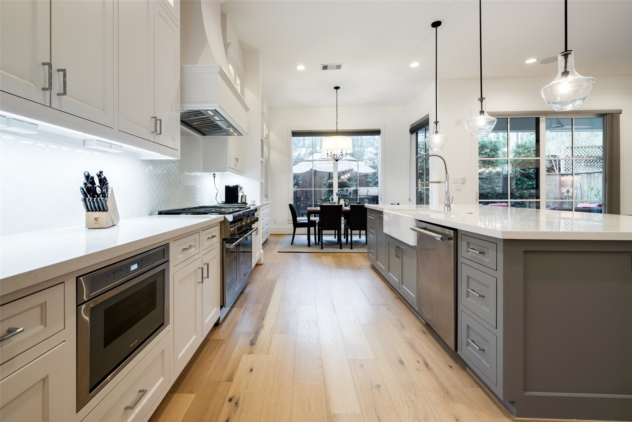 1918 Woodhead Street Houston, TX 77019 - Photo 26 of 49 a large kitchen with stainless steel appliances lots of counter space and a sink