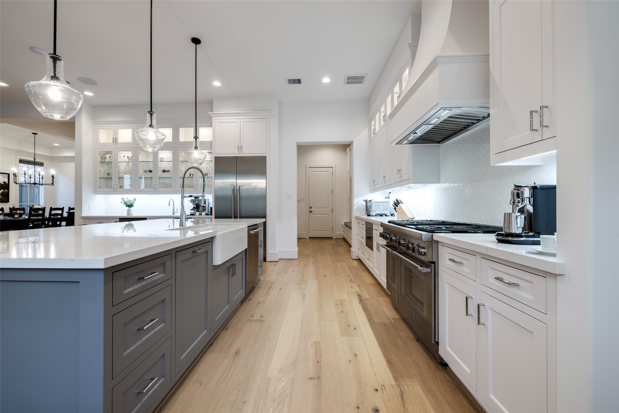 1918 Woodhead Street Houston, TX 77019 - Photo 27 of 49 a large kitchen with stainless steel appliances lots of counter space and a sink