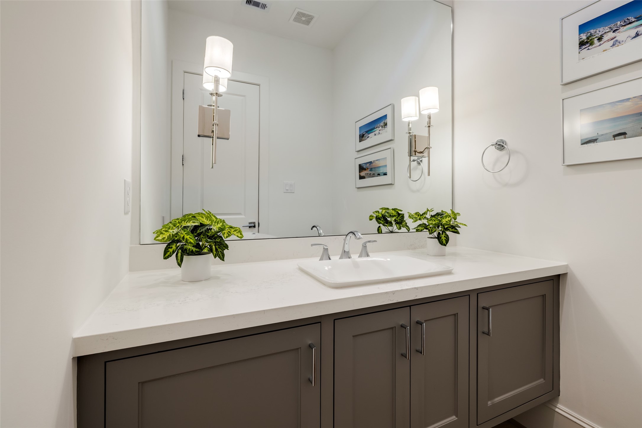 1918 Woodhead Street Houston, TX 77019 - Photo 32 of 49 a bathroom with a sink and a mirror