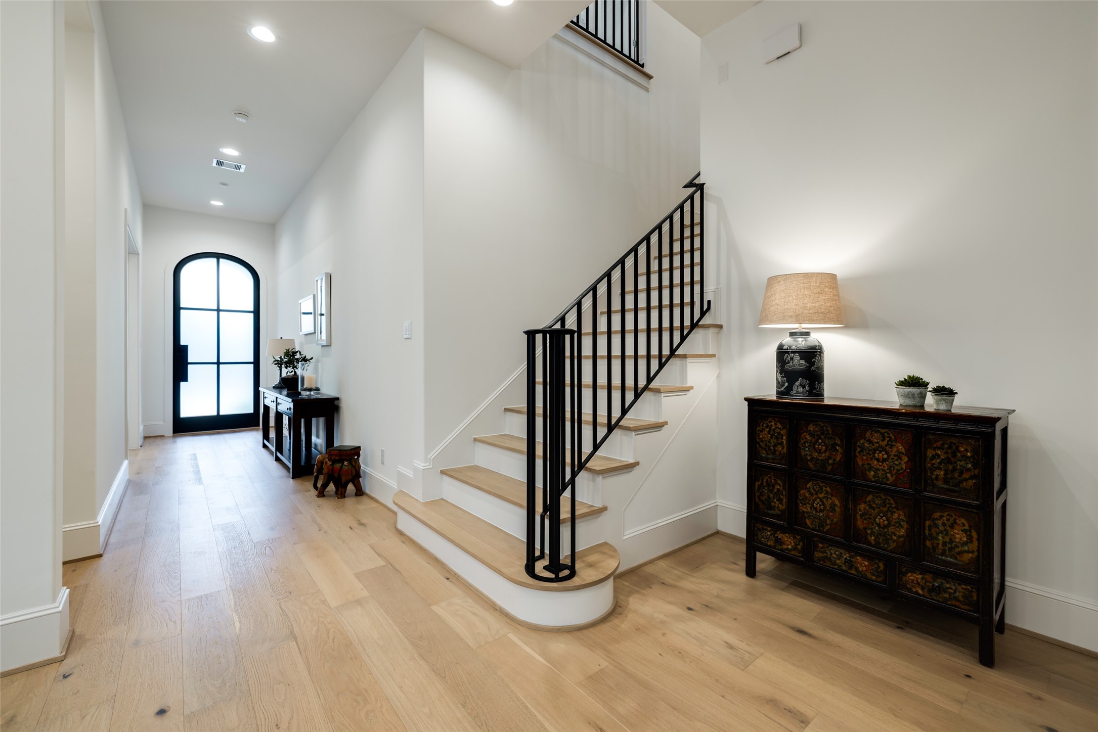 1918 Woodhead Street Houston, TX 77019 - Photo 33 of 49 a view of a livingroom with wooden floor and furniture