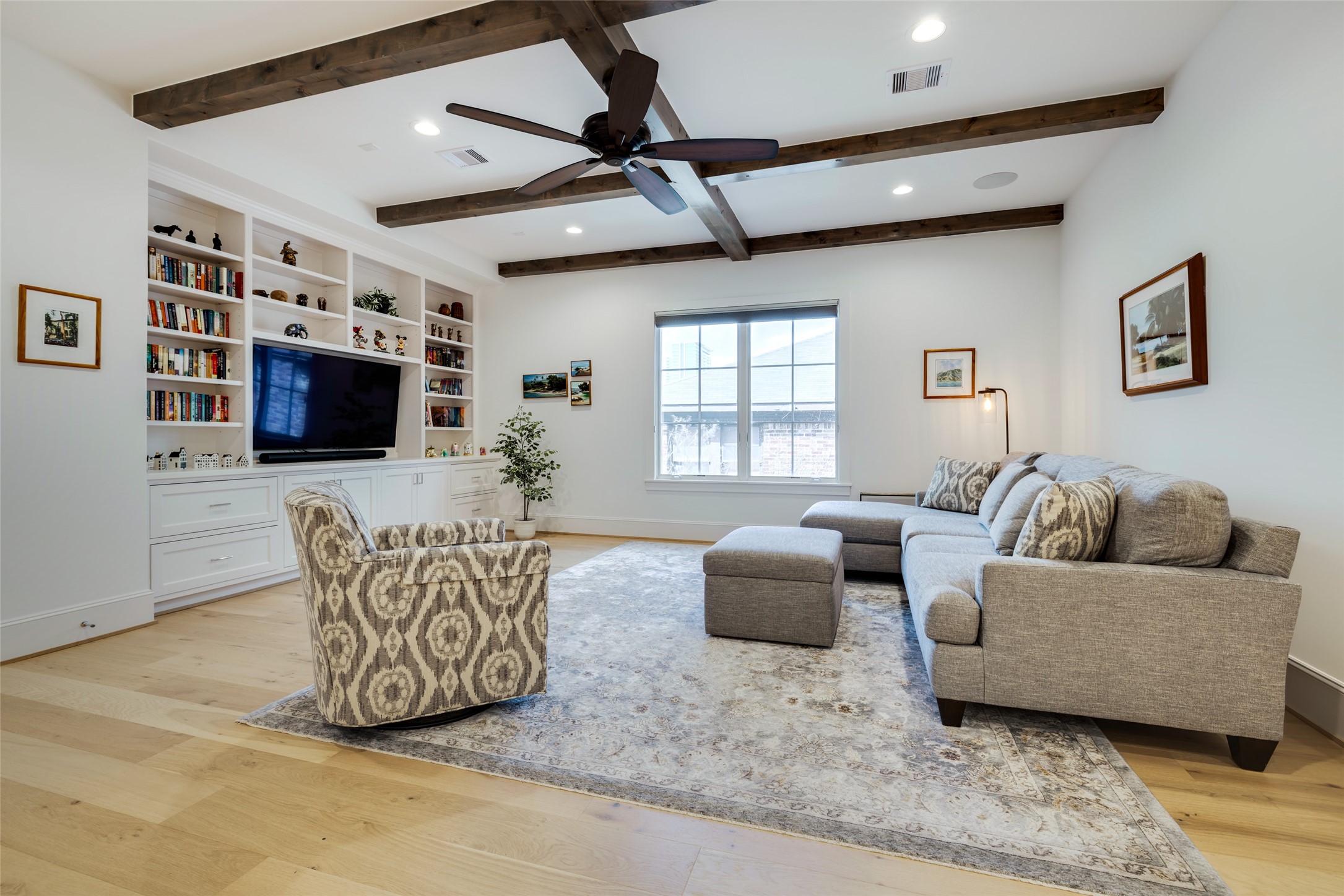 1918 Woodhead Street Houston, TX 77019 - Photo 34 of 49 a living room with furniture a flat screen tv and a window