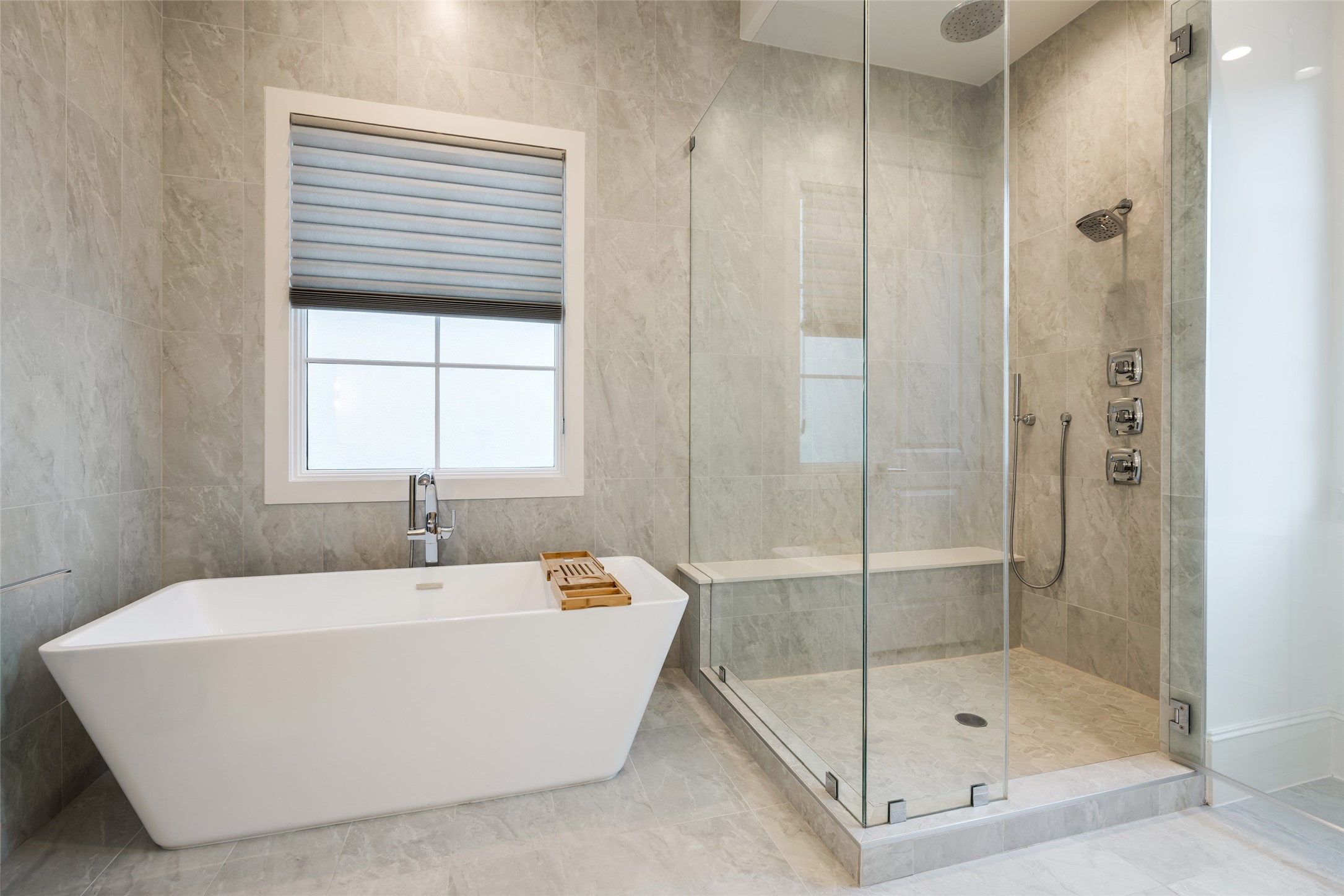 1918 Woodhead Street Houston, TX 77019 - Photo 38 of 49 a white bath tub sitting next to a shower