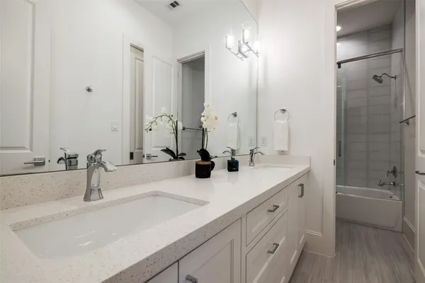 a utility room with sink dryer and washer