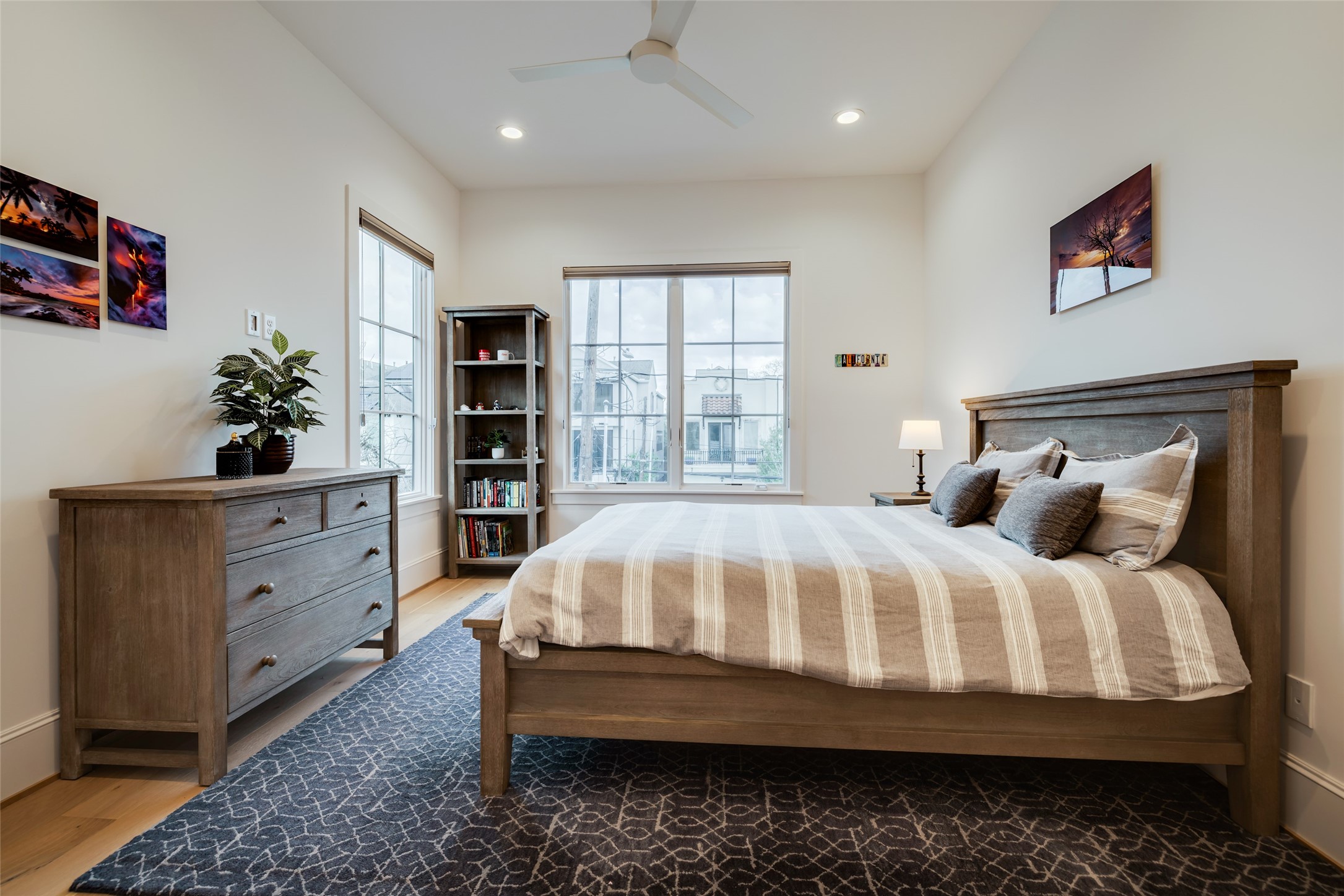 1918 Woodhead Street Houston, TX 77019 - Photo 44 of 49 a bed sitting in a bedroom next to a window