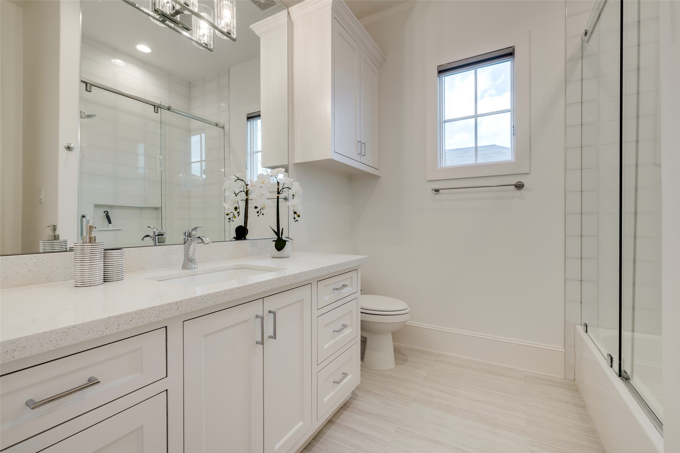 1918 Woodhead Street Houston, TX 77019 - Photo 45 of 49 a bathroom with a sink a toilet and a mirror