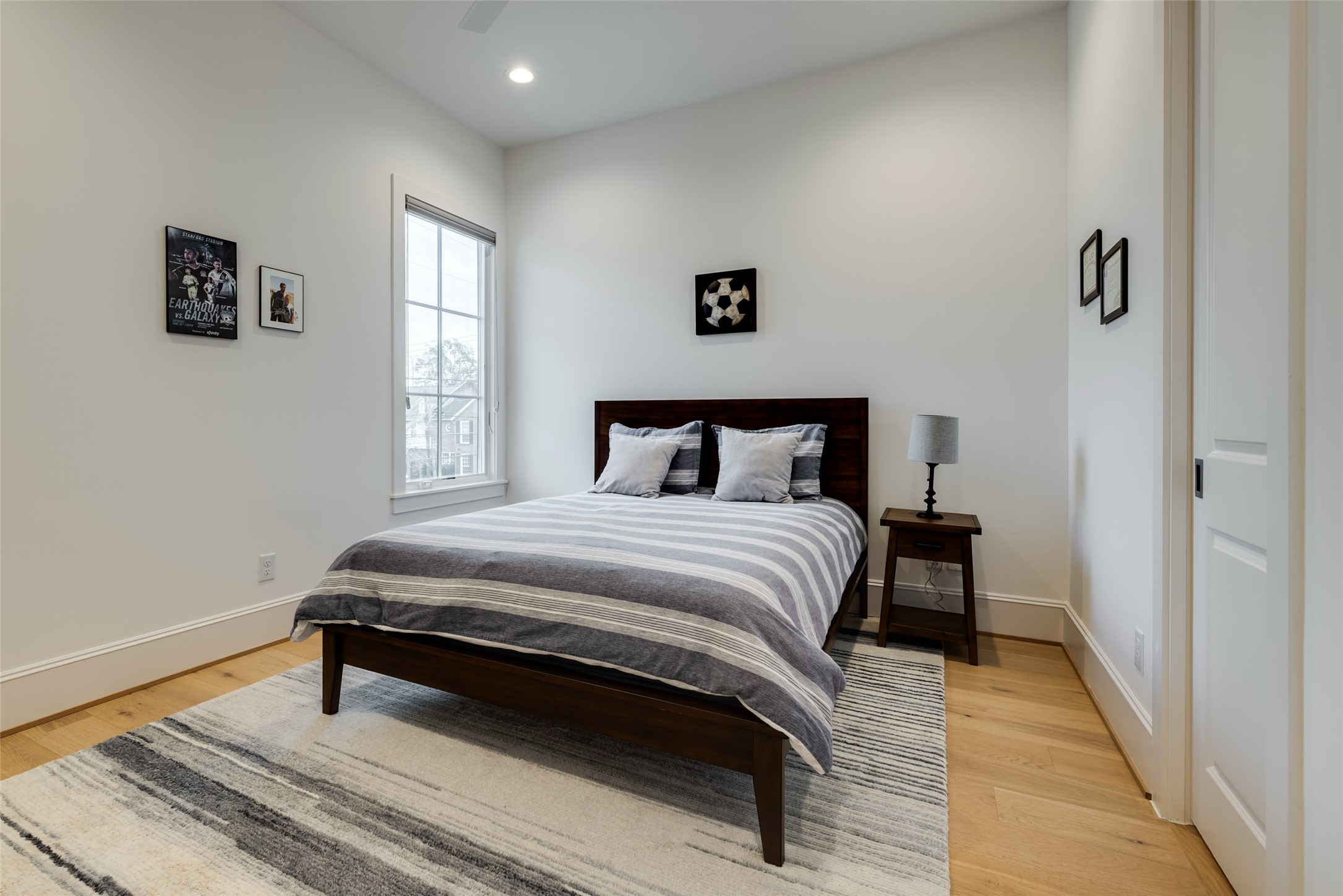 1918 Woodhead Street Houston, TX 77019 - Photo 47 of 49 a bedroom with a bed and window