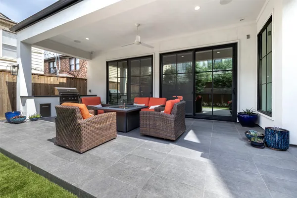a living room with furniture and large windows
