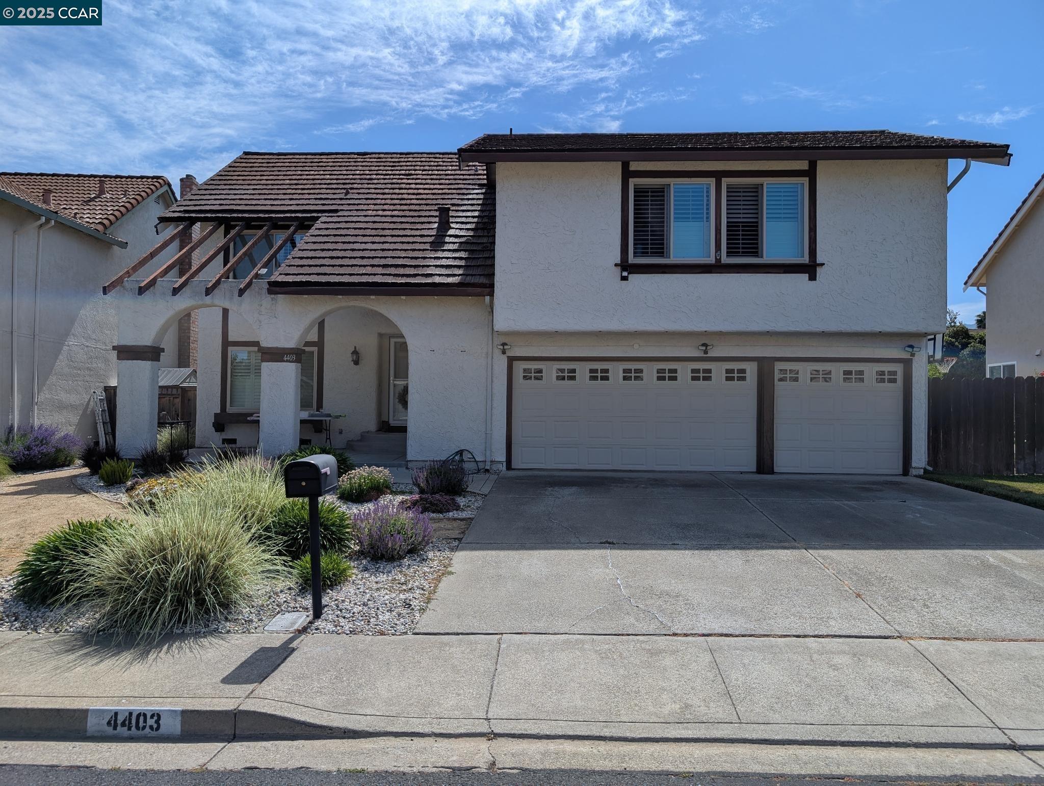 4403 Winterberry Court Concord, CA 94521 - Photo 1 of 1 a front view of a house with garden