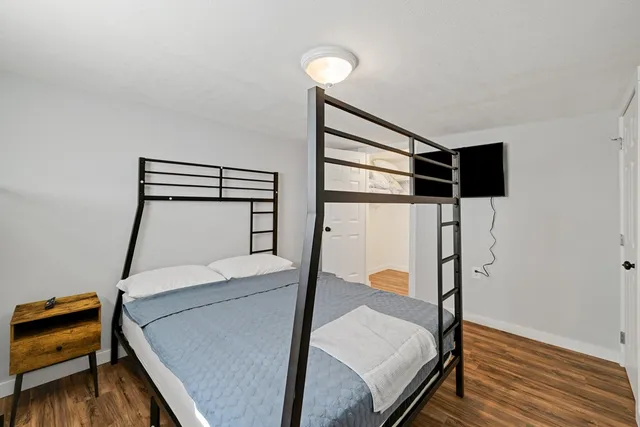 a room with stairs and wooden floor