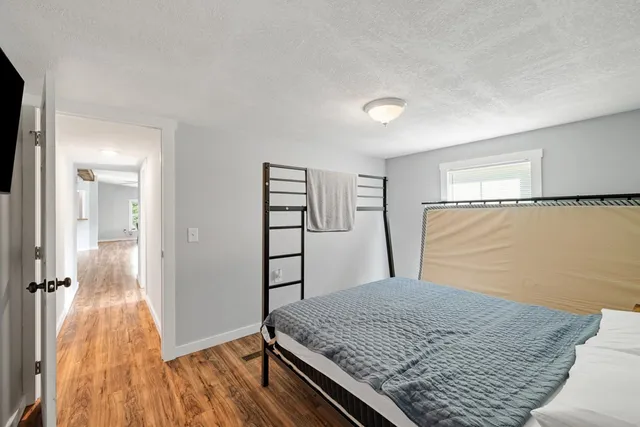 a bedroom with a bed and a dresser