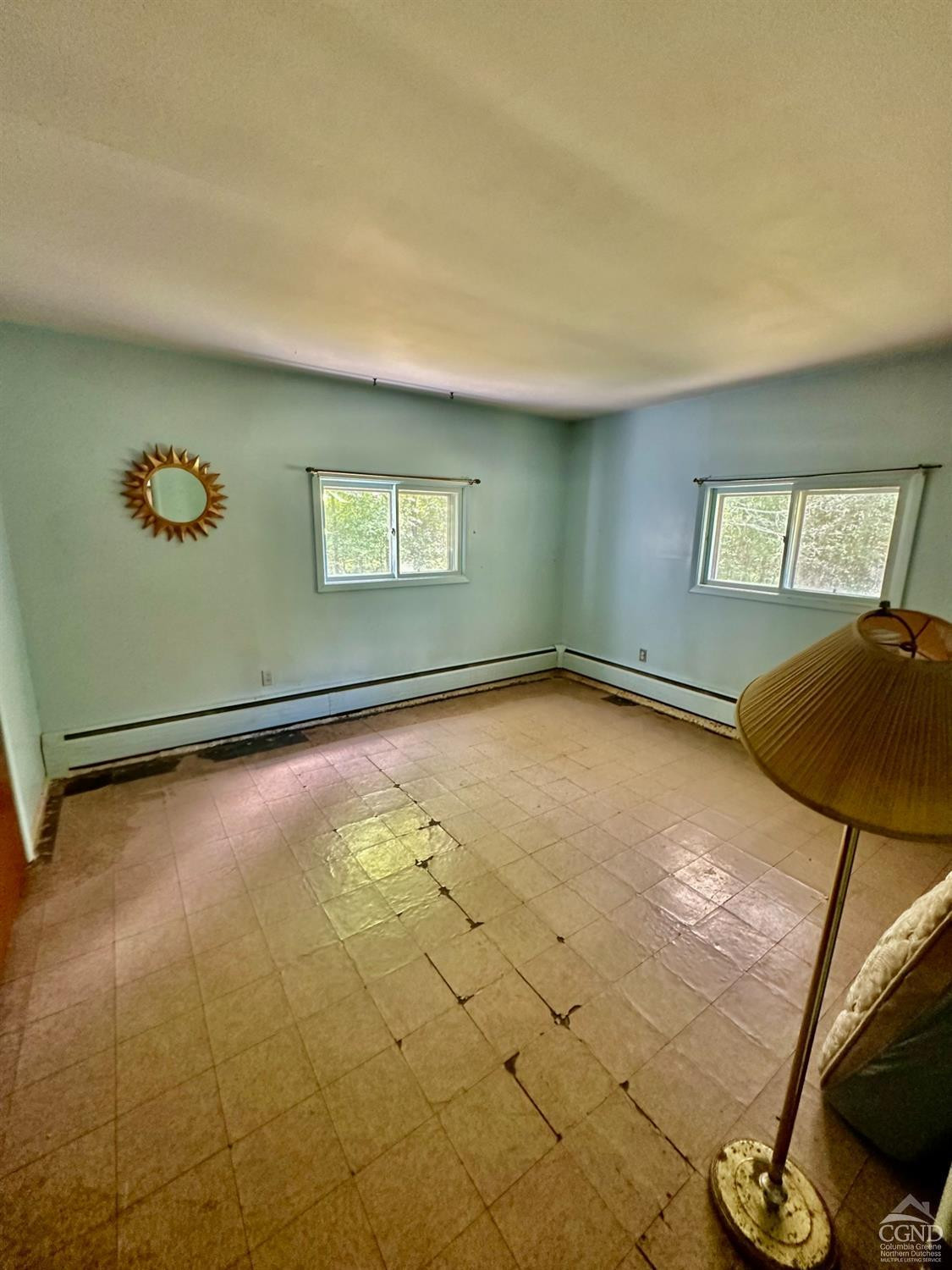 215 Vernal Butler Road Cairo, NY 12413 - Photo 13 of 24 a view of a livingroom with an empty space and a window