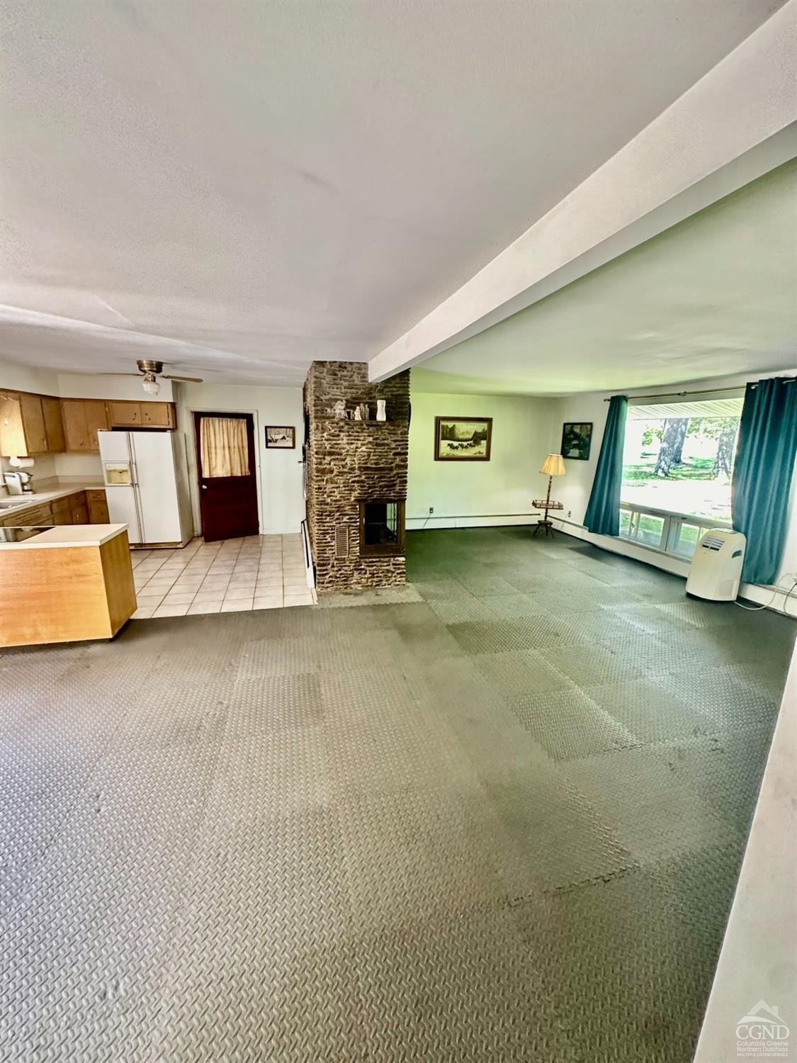 215 Vernal Butler Road Cairo, NY 12413 - Photo 7 of 24 a view of a livingroom with furniture and a ceiling fan