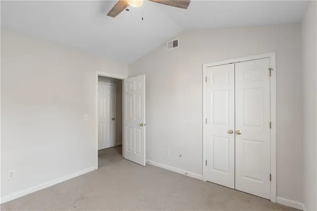 an empty room with closet area