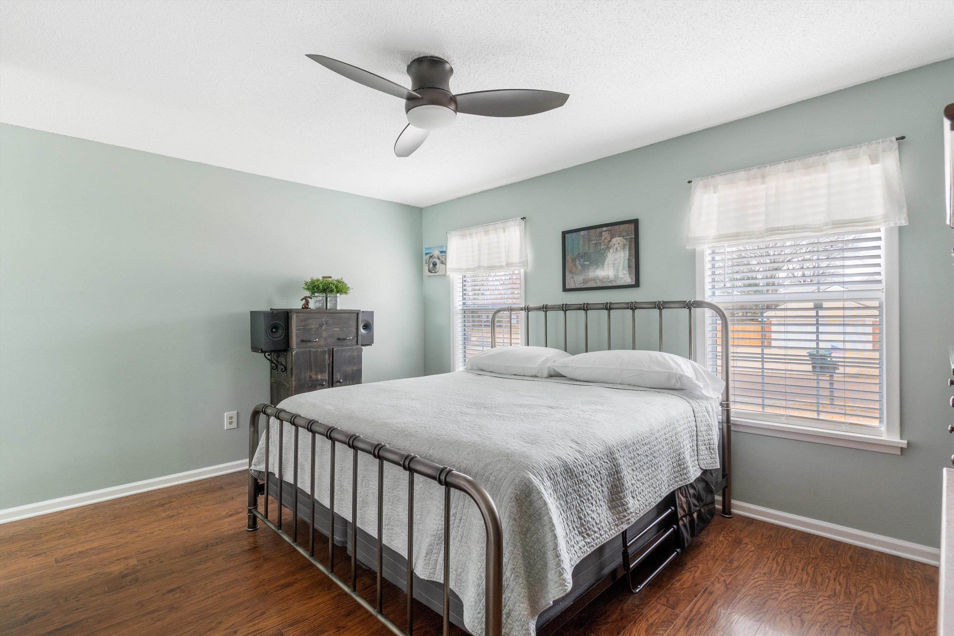 2984 Ruffle Drive Bartlett, TN 38134 - Photo 12 of 31 a bedroom with a bed and a chandelier