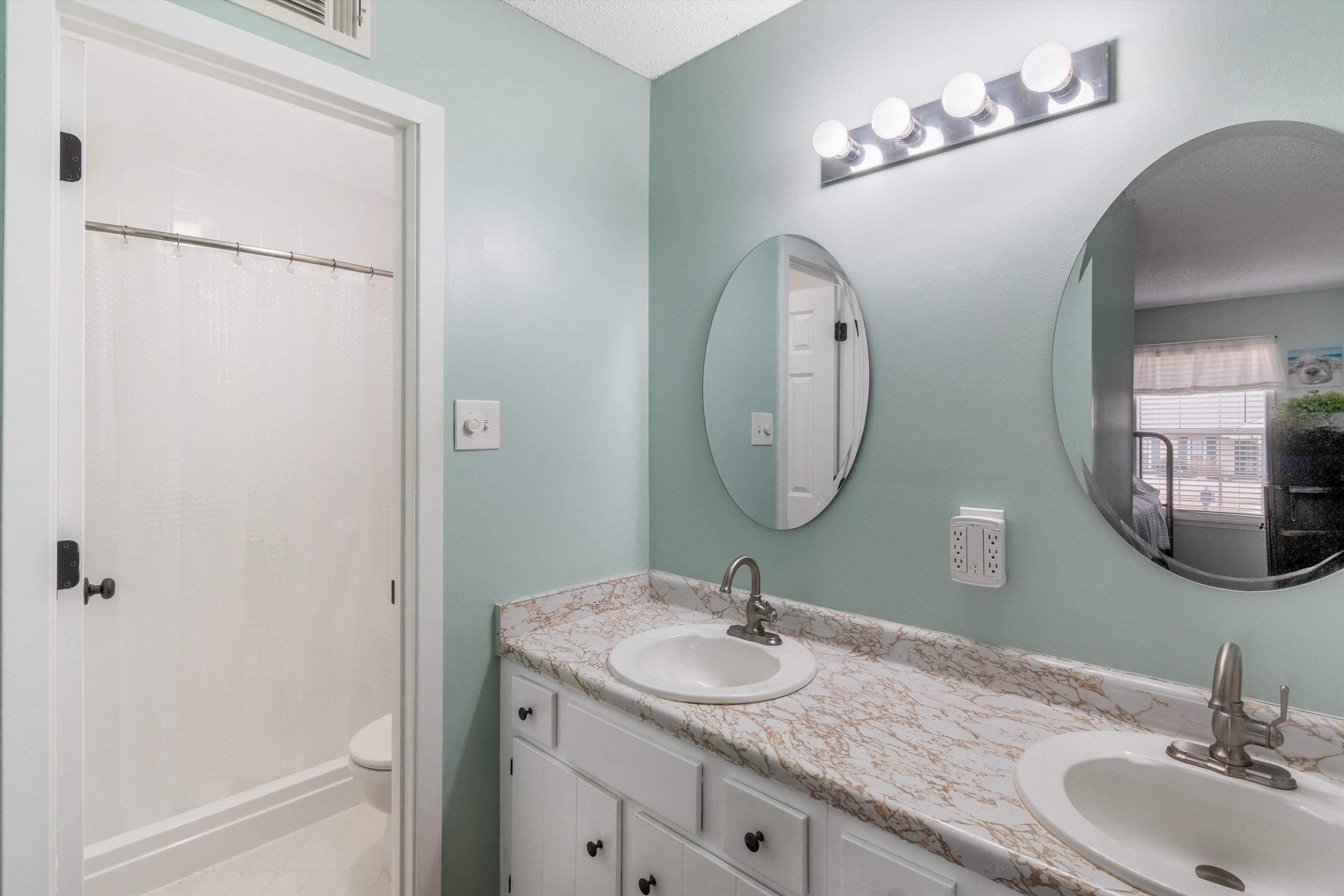 2984 Ruffle Drive Bartlett, TN 38134 - Photo 16 of 31 a bathroom with a granite countertop sink and a mirror