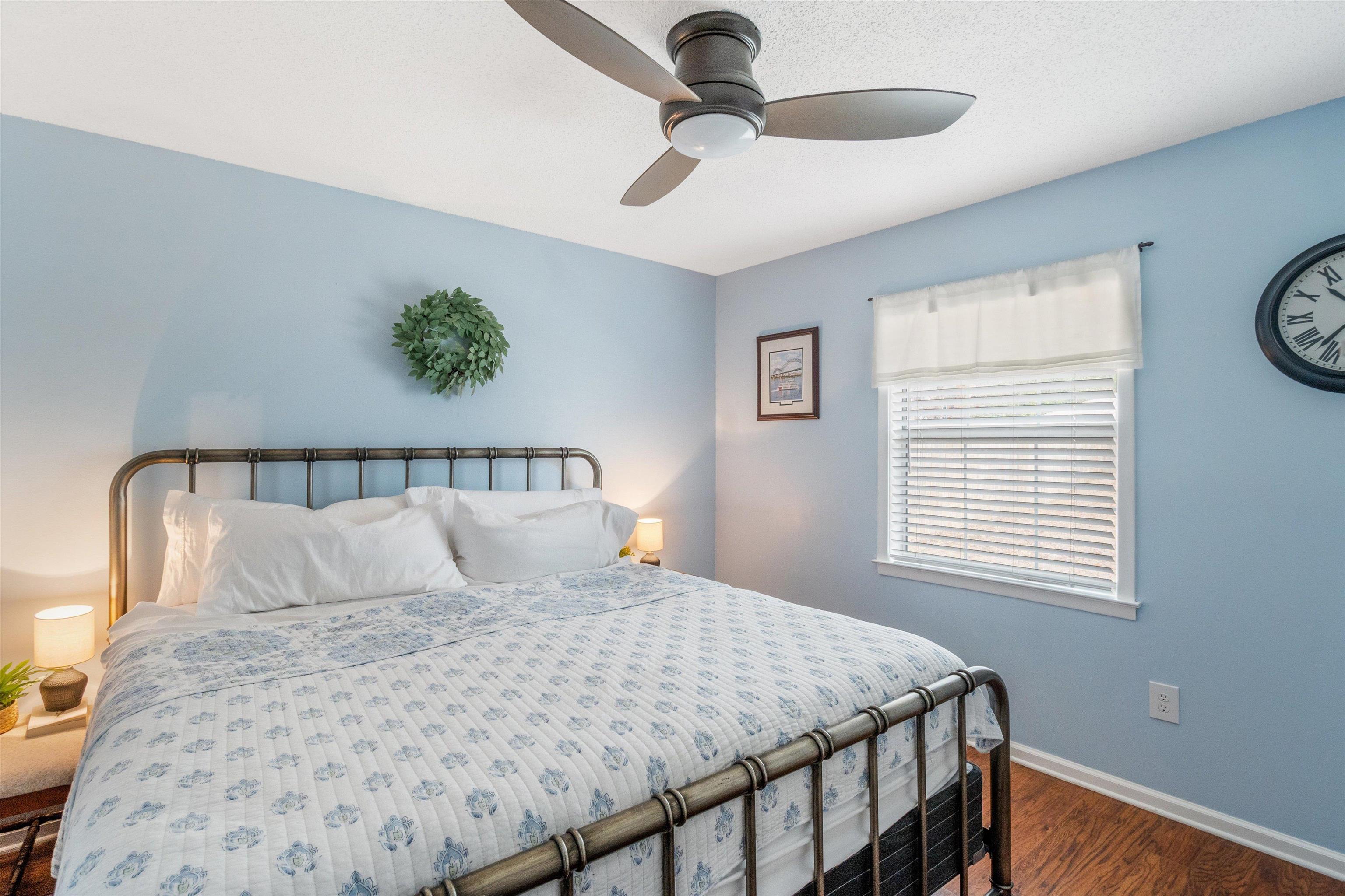 2984 Ruffle Drive Bartlett, TN 38134 - Photo 21 of 31 a bedroom with a large bed and a chandelier