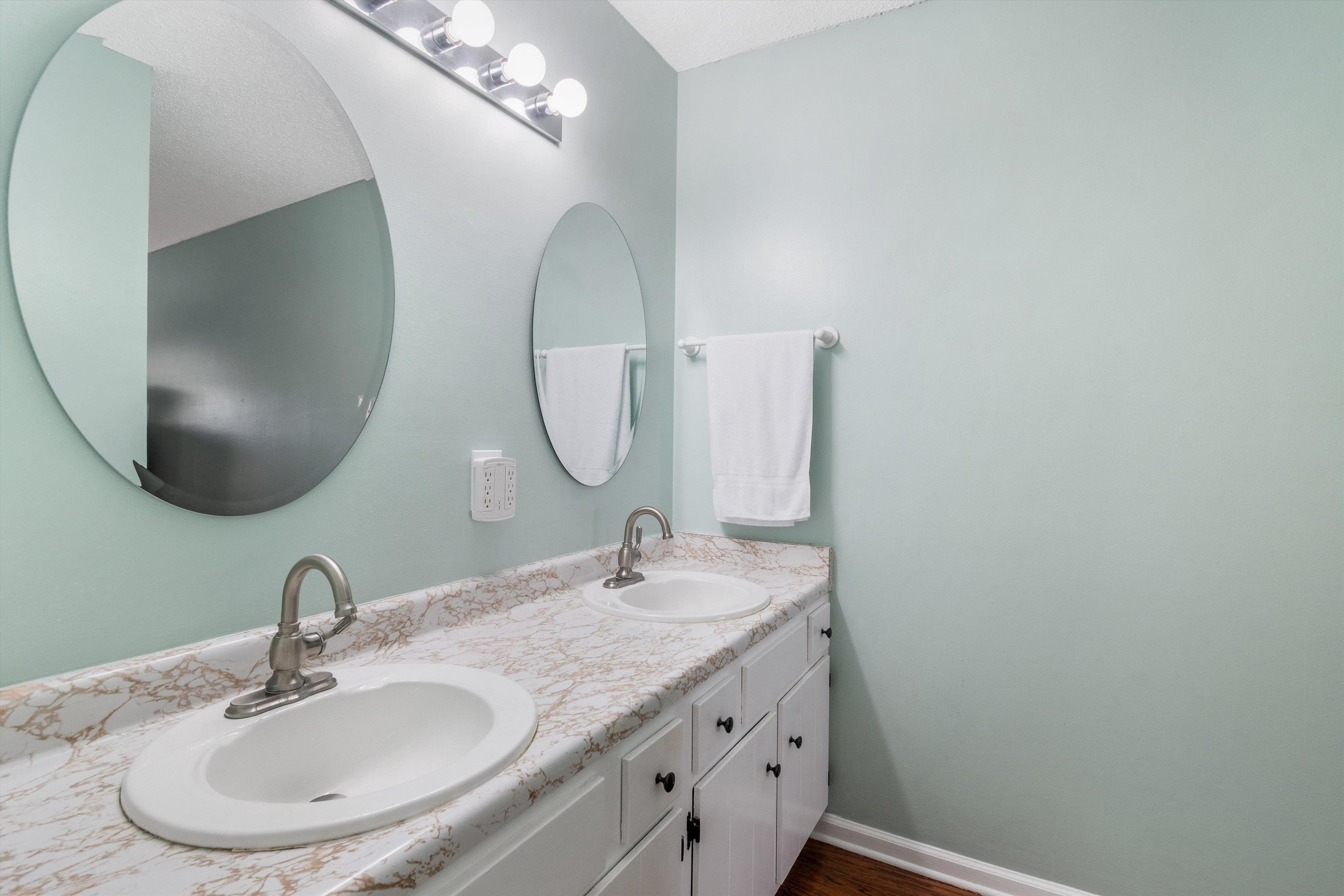 2984 Ruffle Drive Bartlett, TN 38134 - Photo 23 of 31 a bathroom with a granite countertop sink a mirror and a