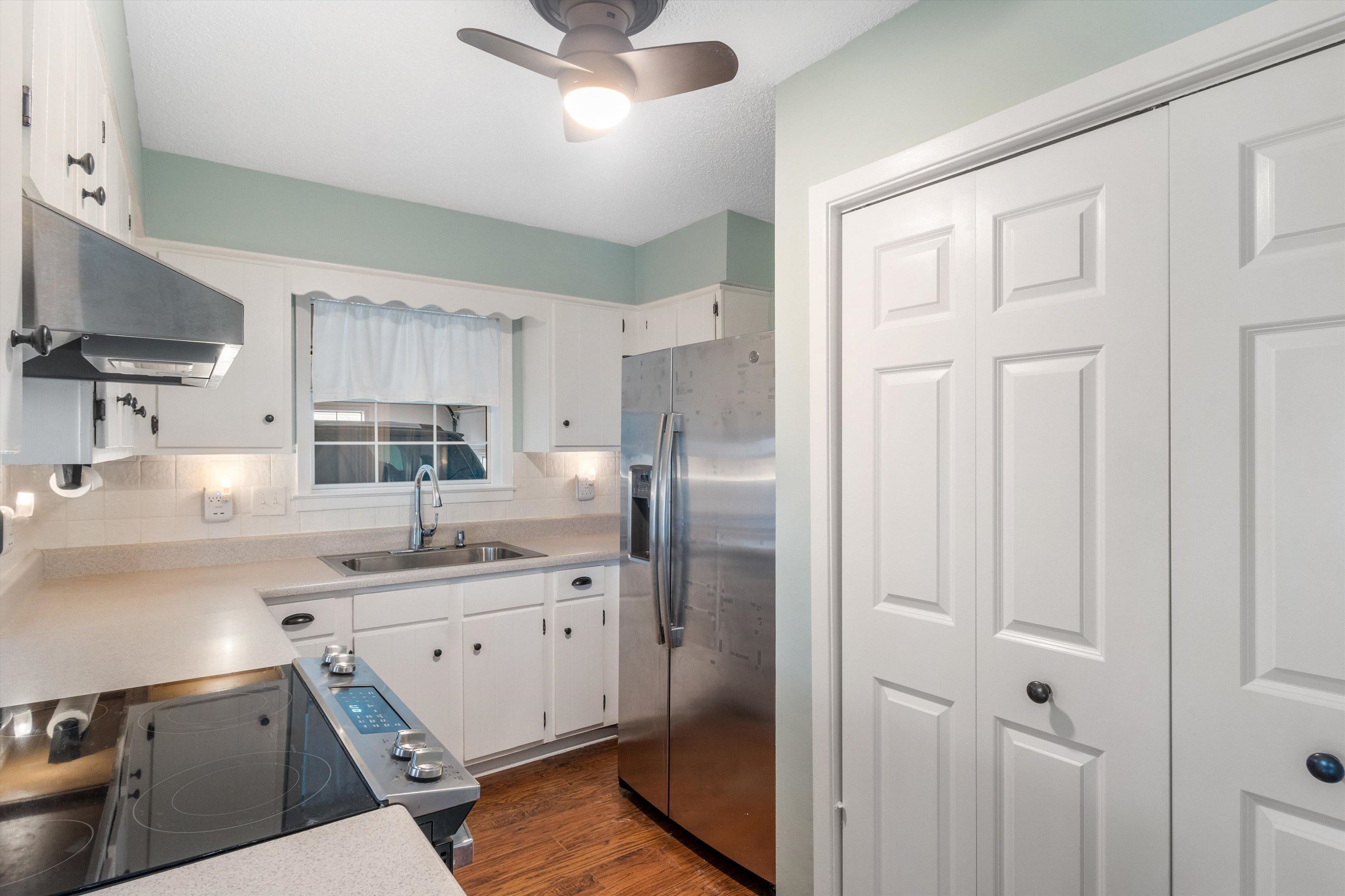 2984 Ruffle Drive Bartlett, TN 38134 - Photo 7 of 31 a kitchen with stainless steel appliances a refrigerator sink and cabinets