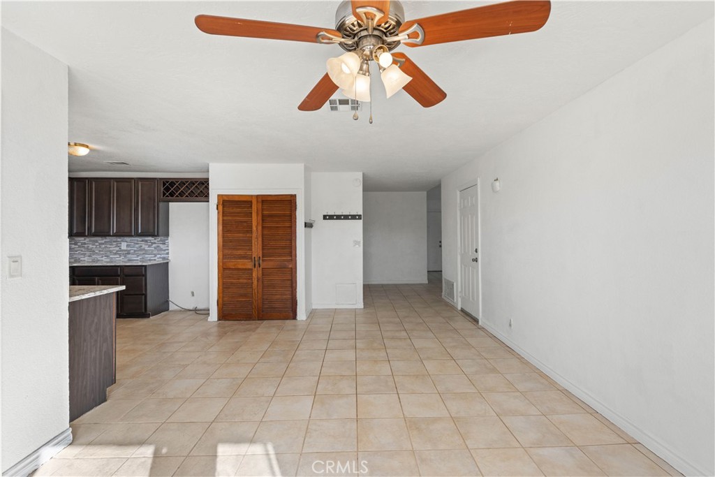 18891 Shoshonee Road Apple Valley, CA 92307 - Photo 6 of 33 a view of an empty room with a kitchen