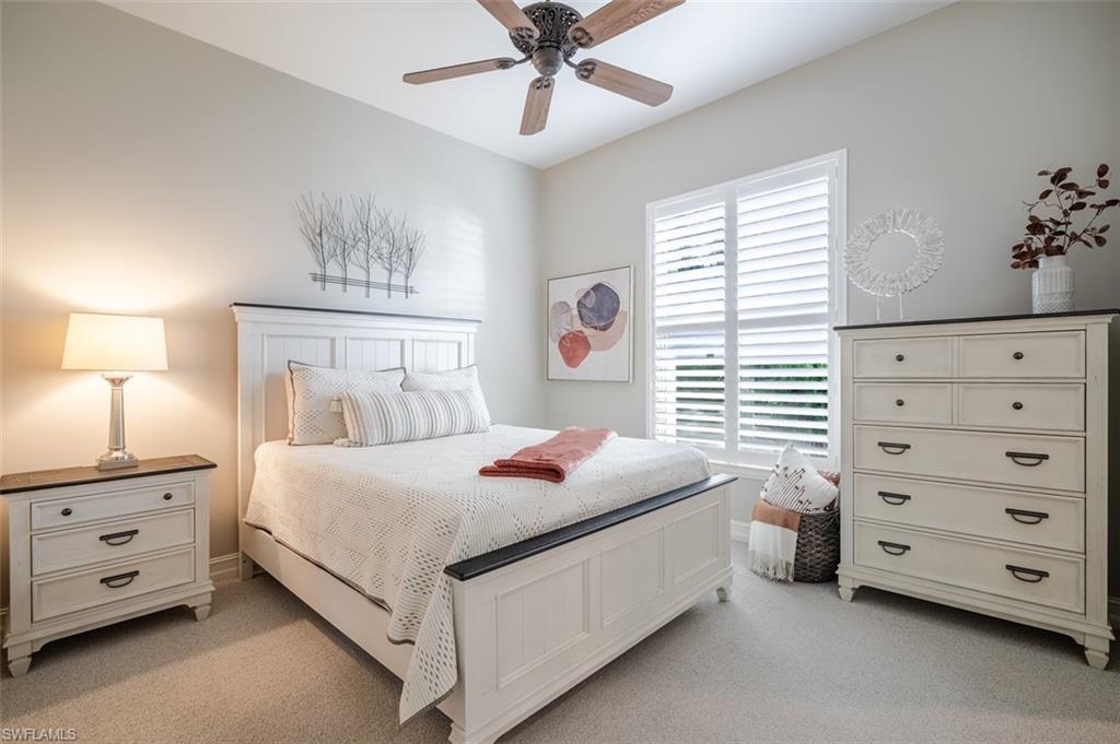 1942 Kingfish Road Naples, FL 34102 - Photo 29 of 43 a bedroom with a bed and a dresser