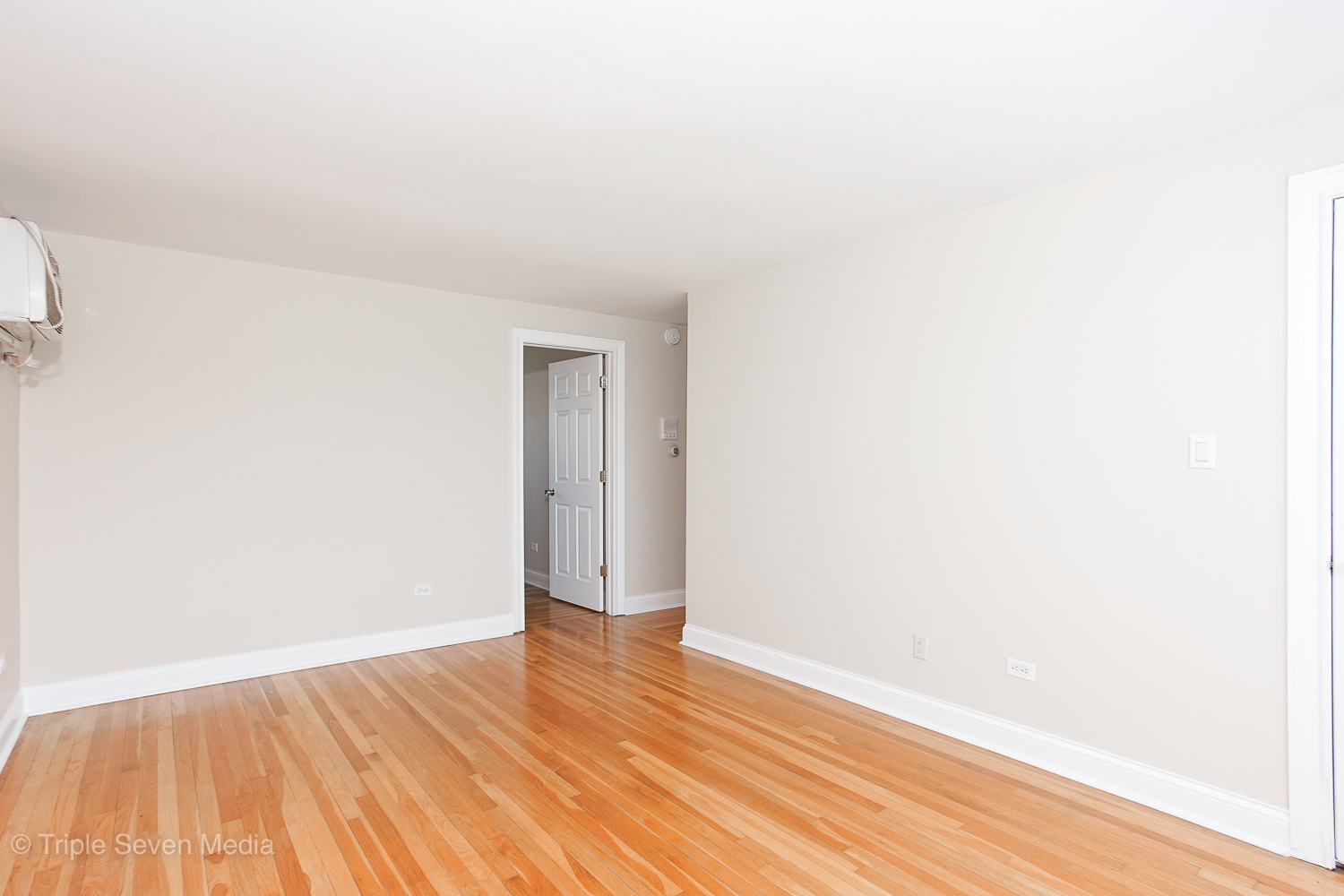 6952 West 65th Street, Unit 3C Chicago, IL 60638 - Photo 13 of 17 a view of an empty room with wooden floor and a window