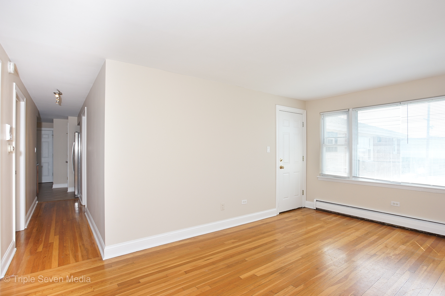 6952 West 65th Street, Unit 3C Chicago, IL 60638 - Photo 14 of 17 a view of empty room with wooden floor and fan