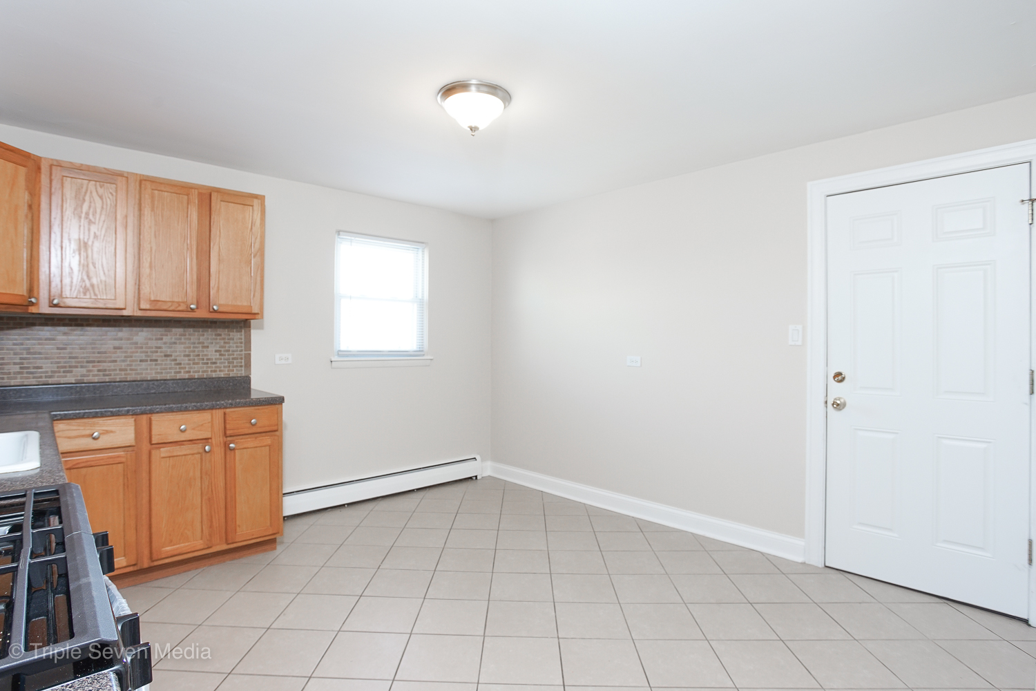 6952 West 65th Street, Unit 3C Chicago, IL 60638 - Photo 4 of 17 a view of an empty room with a window