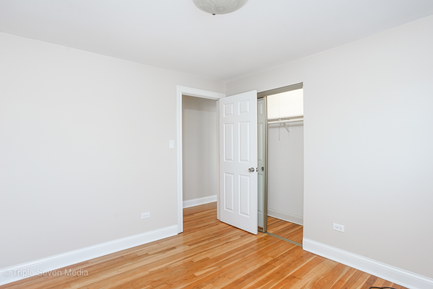 6952 West 65th Street, Unit 3C Chicago, IL 60638 - Photo 9 of 17 a view of an empty room with wooden floor
