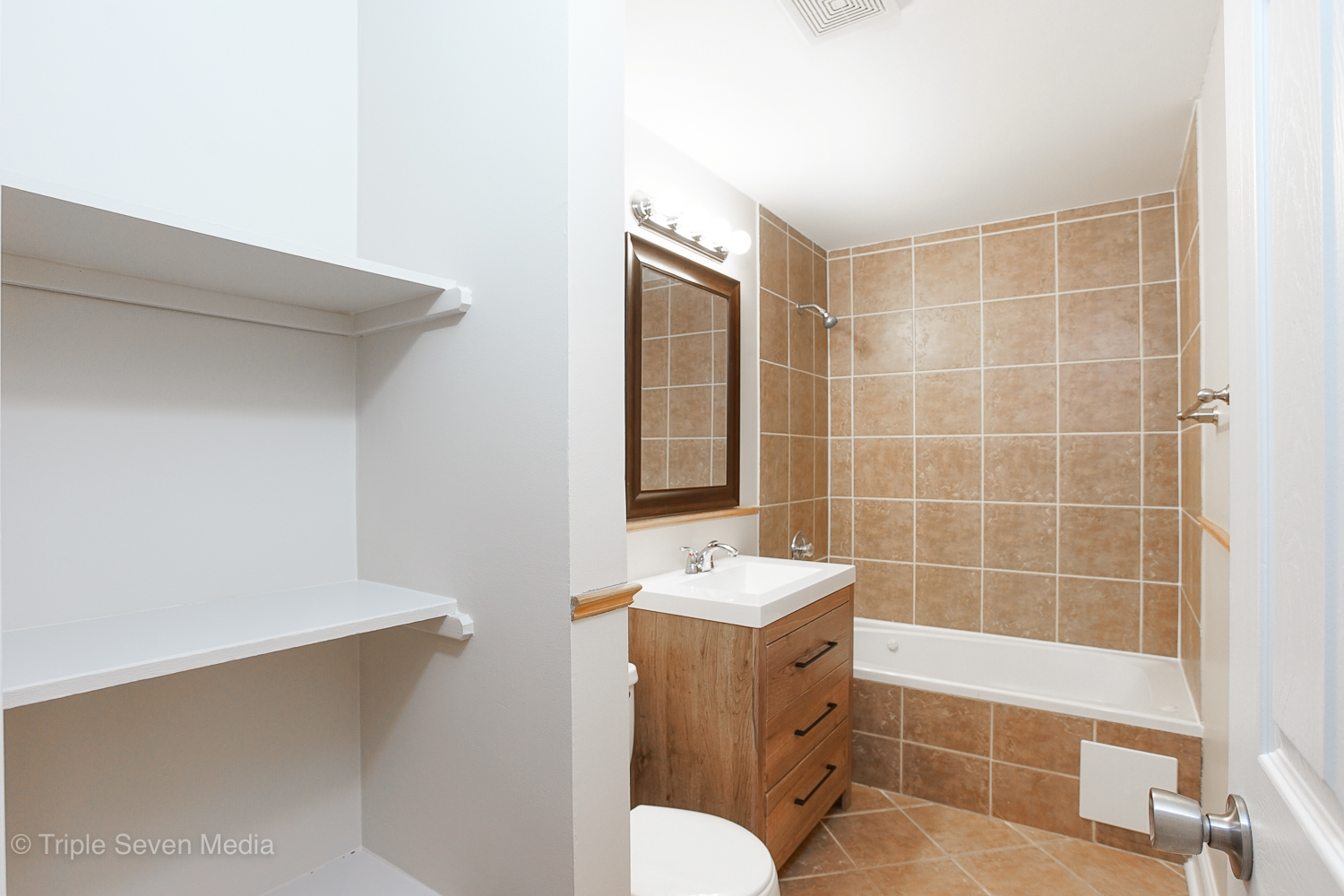 6952 West 65th Street, Unit 3C Chicago, IL 60638 - Photo 10 of 17 a bathroom with a sink a toilet and shower