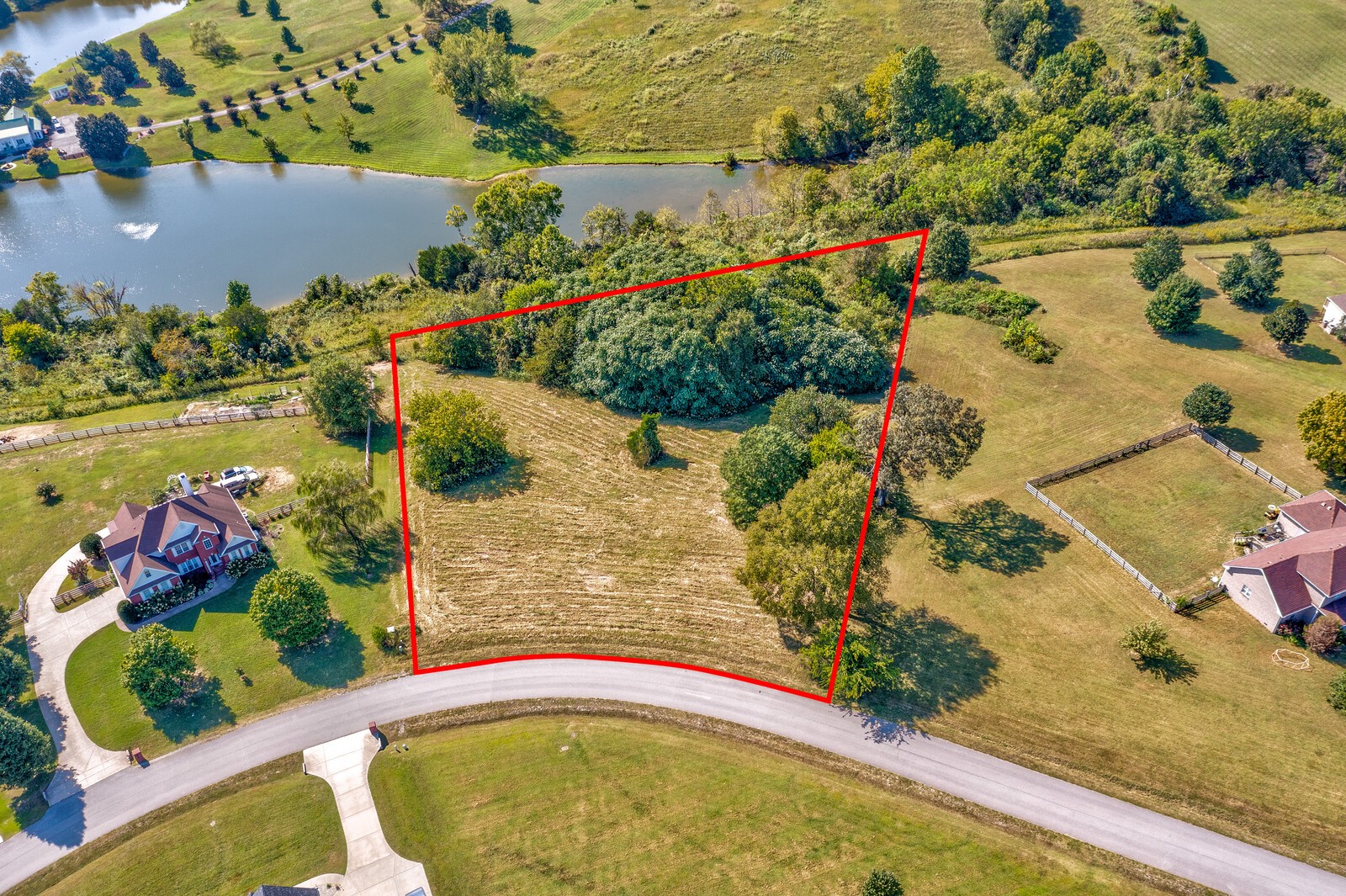 0 Trinity Burns, TN 37029 - Photo 1 of 18 an aerial view of a house with a yard and lake view