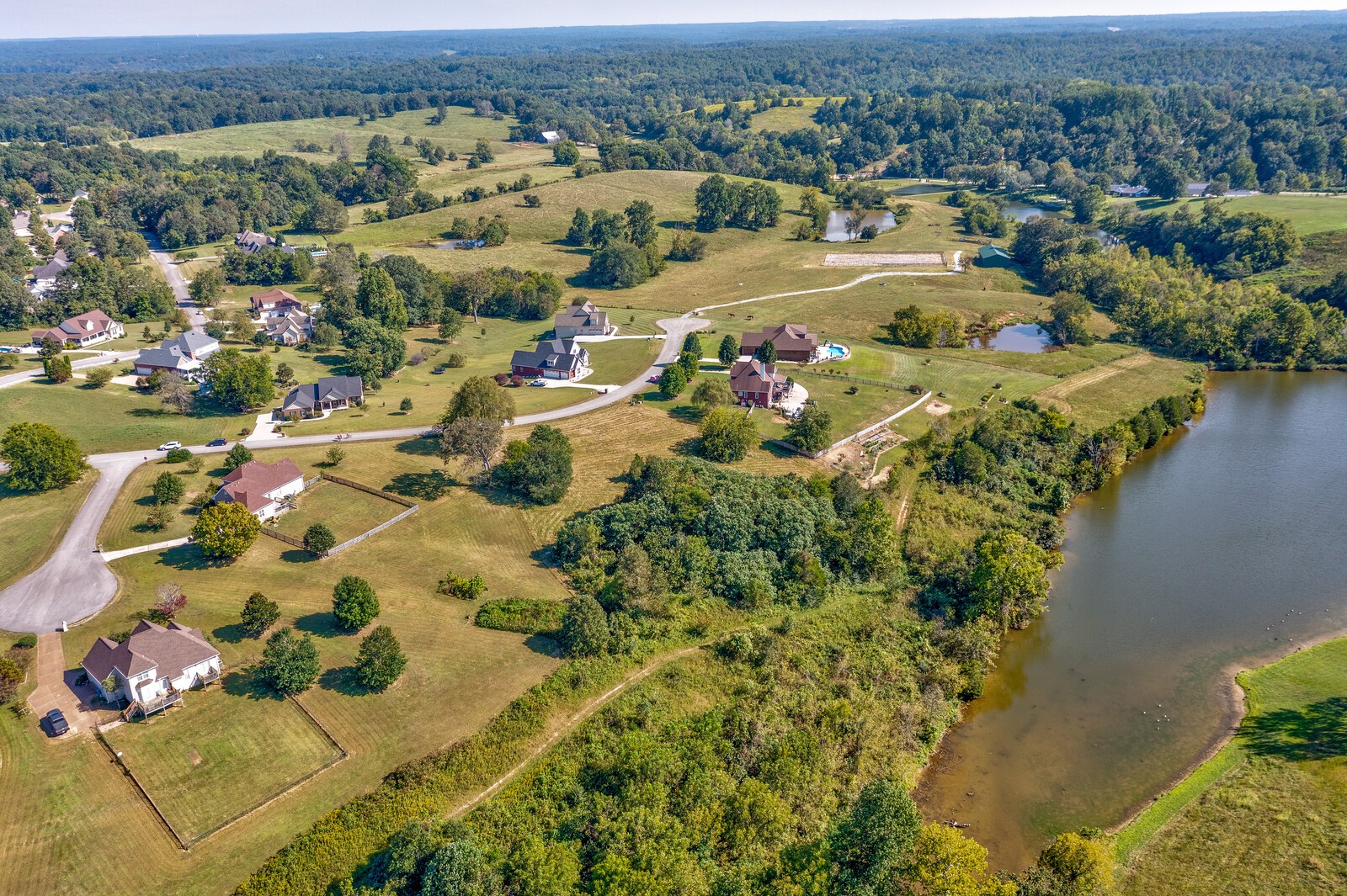 0 Trinity Burns, TN 37029 - Photo 13 of 18 an aerial view of a houses with a lake