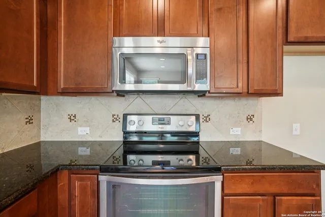 a kitchen with a stove and a microwave