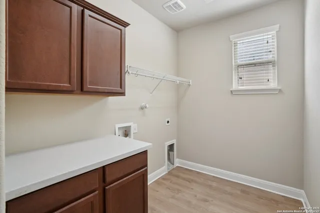 a view of storage area and utility room