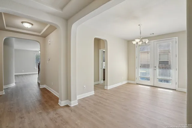 wooden floor and windows in an empty room