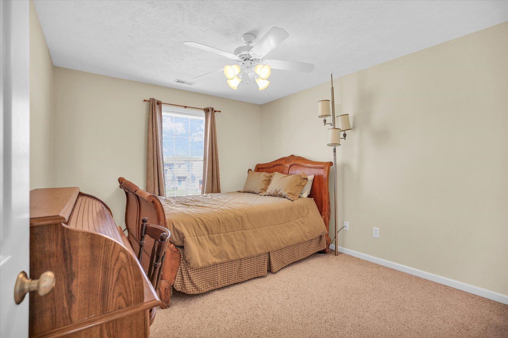 4619 Copper Ridge Road Champaign, IL 61822 - Photo 22 of 29 a bedroom with a bed and window