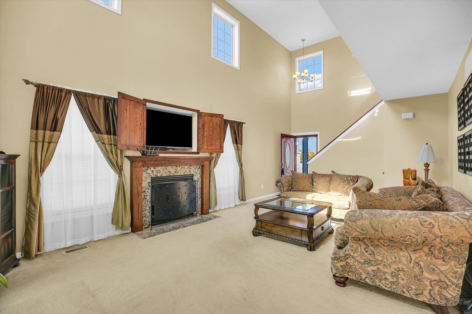 4619 Copper Ridge Road Champaign, IL 61822 - Photo 7 of 29 a living room with furniture and a fireplace
