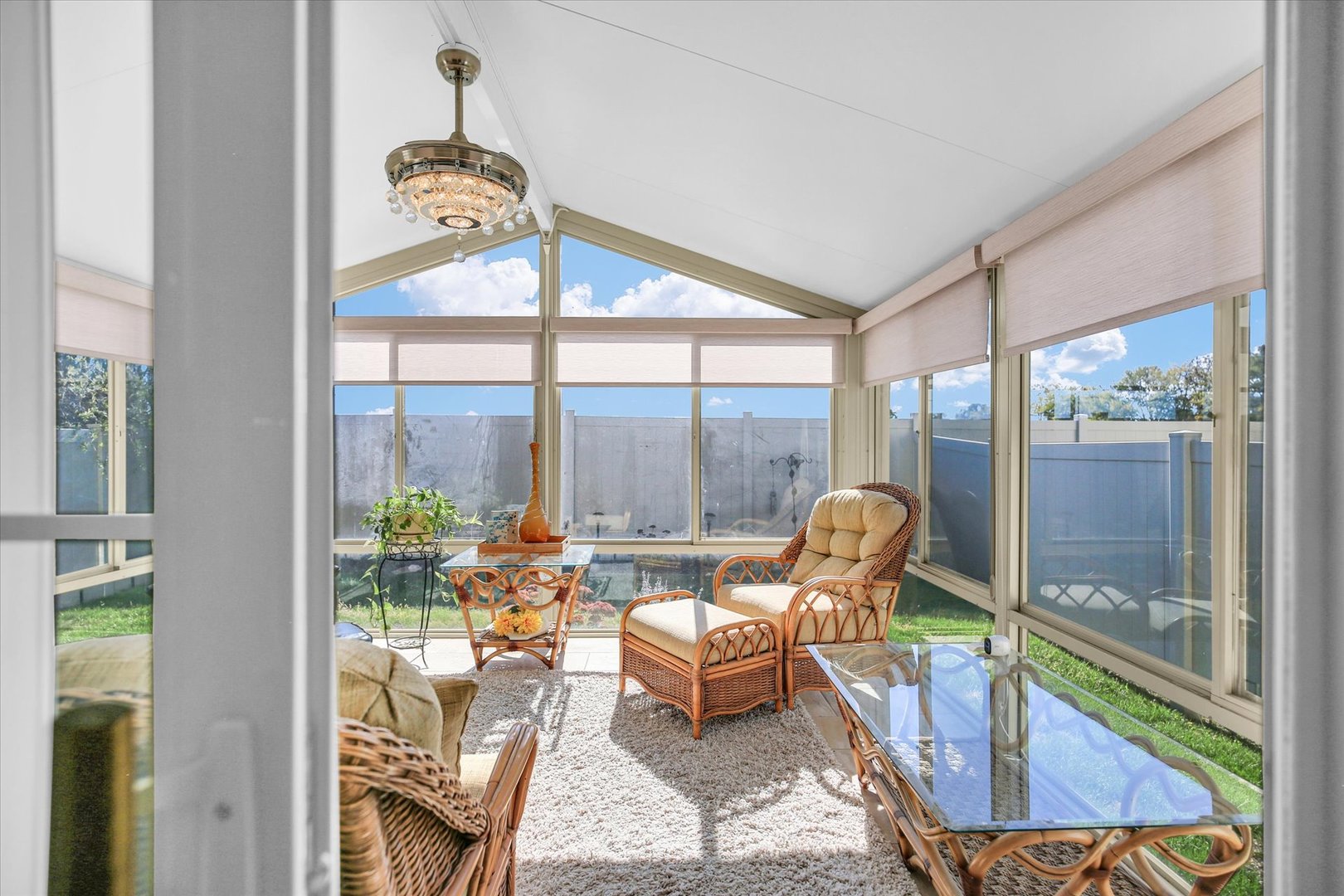 4619 Copper Ridge Road Champaign, IL 61822 - Photo 8 of 29 a living room with patio furniture and a floor to ceiling window
