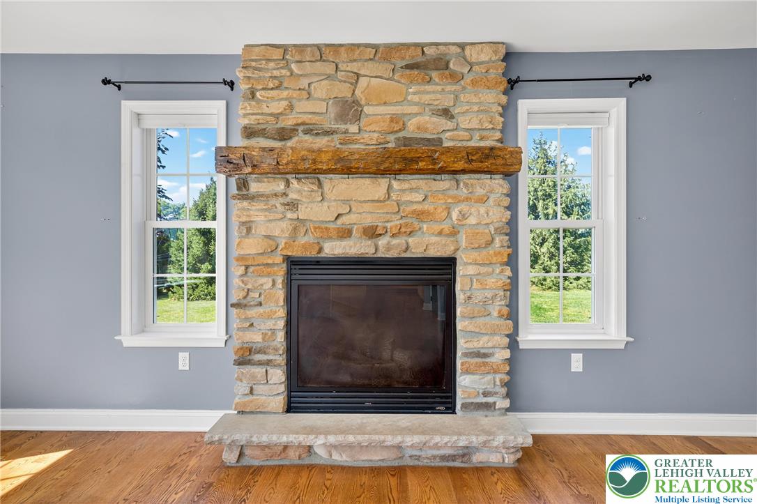 202 Cherry Court Nazareth, PA 18064 - Photo 12 of 43 a living room with a fireplace and a window