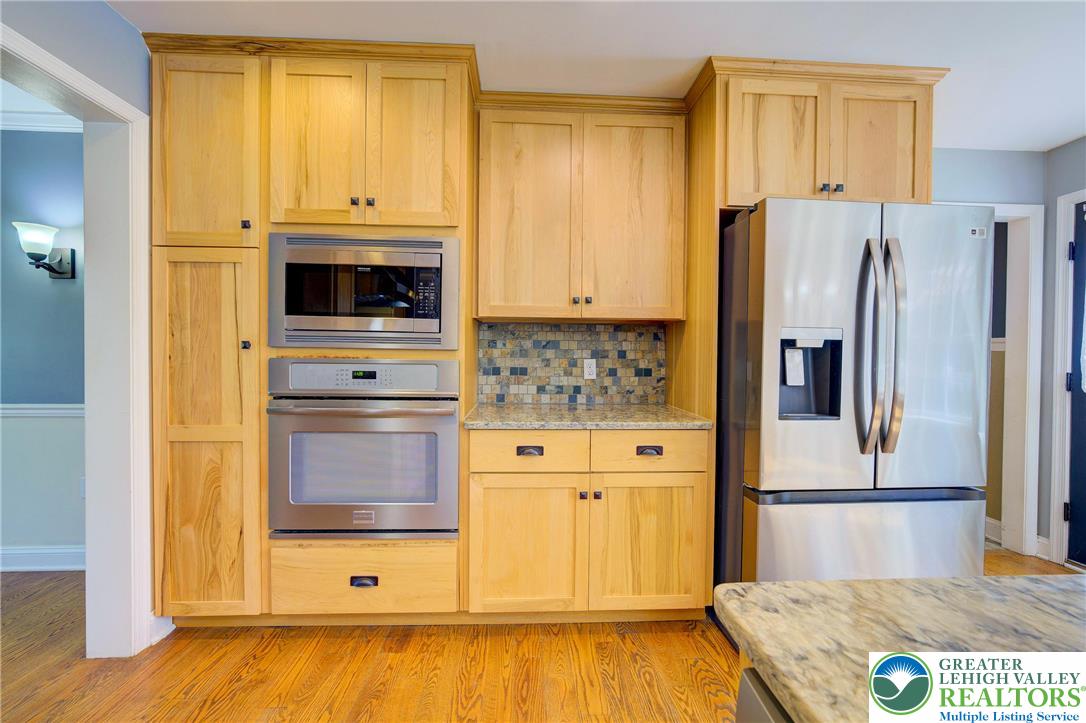 202 Cherry Court Nazareth, PA 18064 - Photo 16 of 43 a kitchen with stainless steel appliances granite countertop a refrigerator and a stove