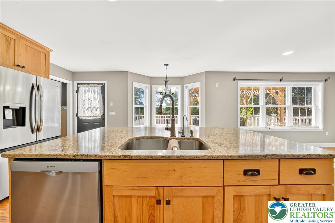 202 Cherry Court Nazareth, PA 18064 - Photo 18 of 43 a kitchen with granite countertop a sink and a window